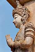 Chiang Mai - The Wat Phra Singh temple. The ho trai (temple library). The stucco figures in high relief of the base showing dancing Devas. 